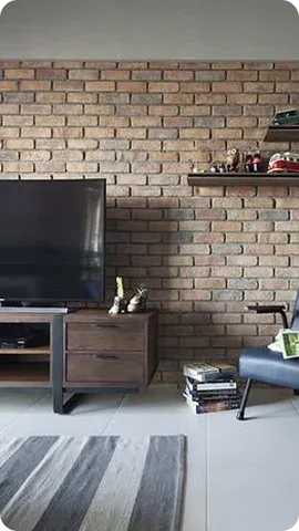 A modern living room featuring a brick wall