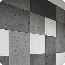 Geometric wall design featuring a pattern of gray and white concrete panels