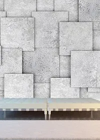 Modern interior with a textured gray wall of layered square panels