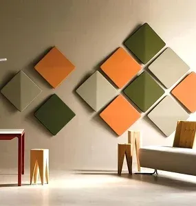 Modern living room featuring a geometric wall design with colorful diamond-shaped panels in green