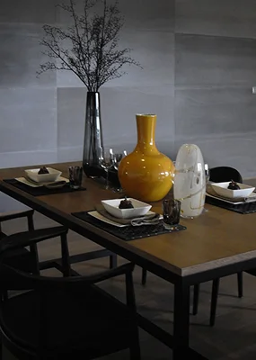 a decorative branch centerpiece against a minimalist backdrop